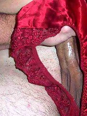 Crossdresser in sexy red knickers plays with cock